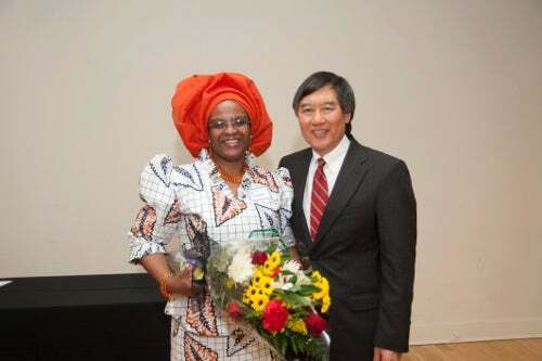 Abimbola Dawson, the 2012 award winner for outstanding non-exempt staff with President Loh.