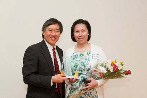 Donna Lim, the 2012 award winner for outstanding exempt staff with President Loh.